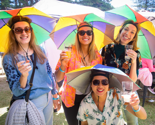 Group of friends with umbrella hats