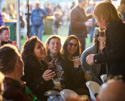 People laughing during a live comedy session