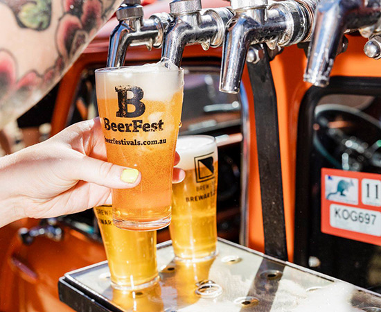 beer pouring into cups